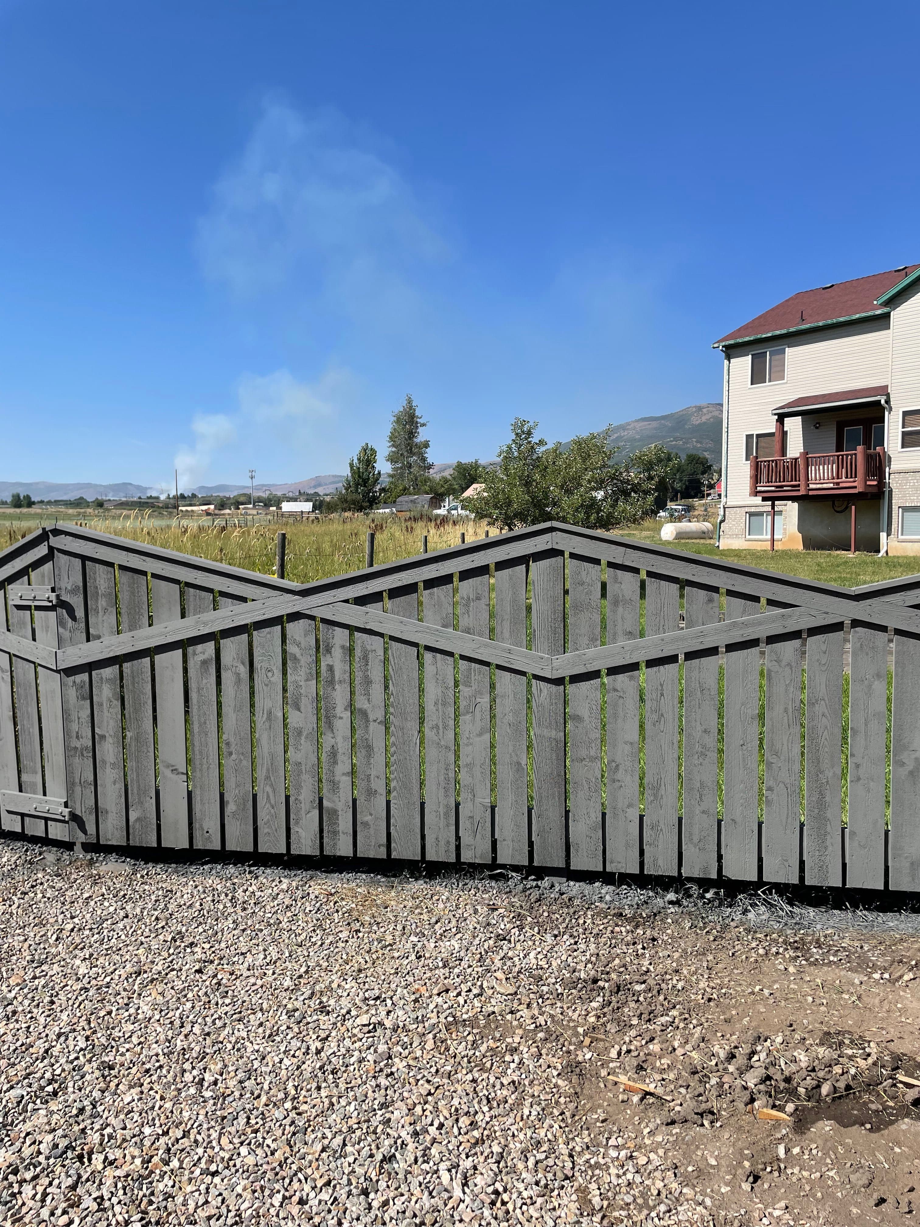 Freshly stained custom cedar privacy fence — recent Alpine Fence & Deck install on the Wasatch Front